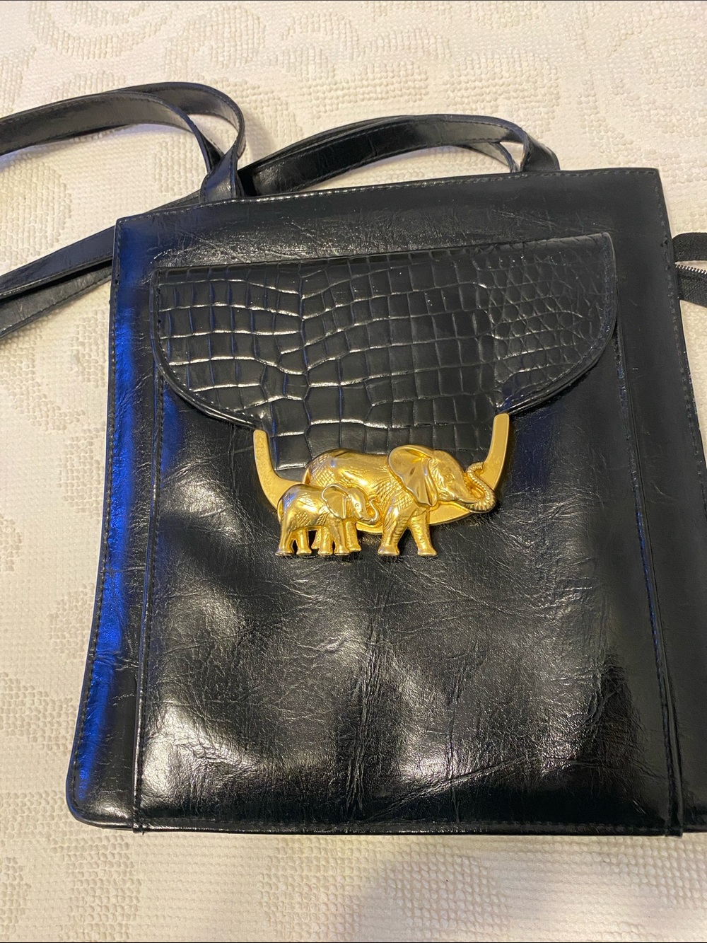 Sasha Black Leather Crossbody Bag with Gold Elephant Detail, minimal wear, clean
